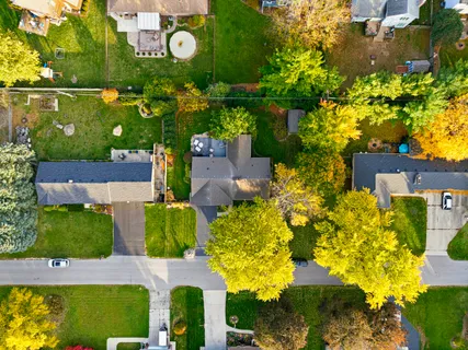 an aerial view of a house with a yard swimming pool outdoor seating and yard