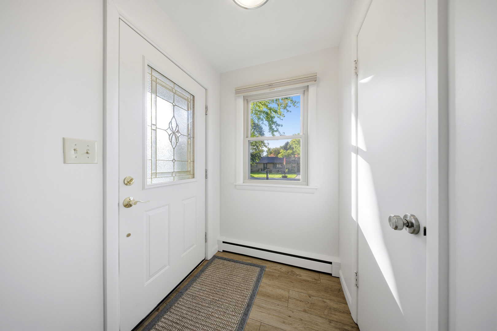 1360 Florence Drive Sycamore, IL 60178 - Photo 14 of 48 a view of an empty room with window and wooden floor