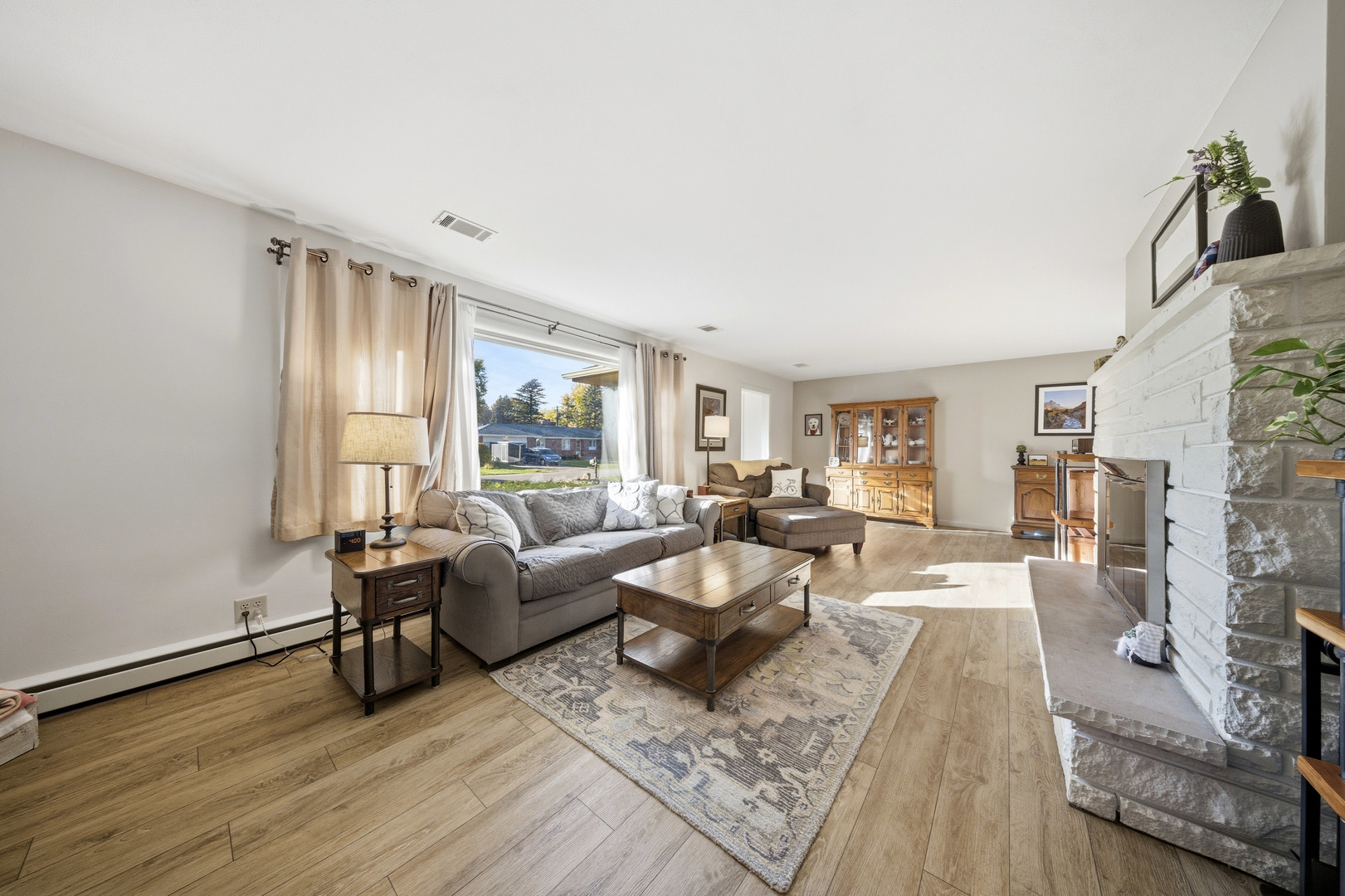 1360 Florence Drive Sycamore, IL 60178 - Photo 17 of 48 a living room with fireplace furniture and a large window