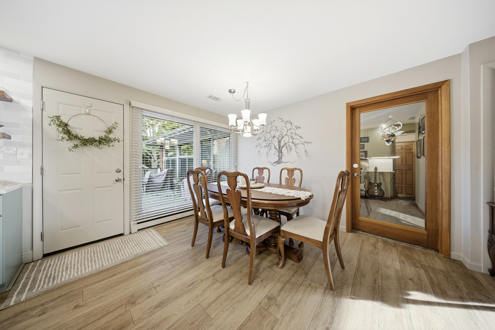 1360 Florence Drive Sycamore, IL 60178 - Photo 19 of 48 a view of a dining room with furniture and wooden floor