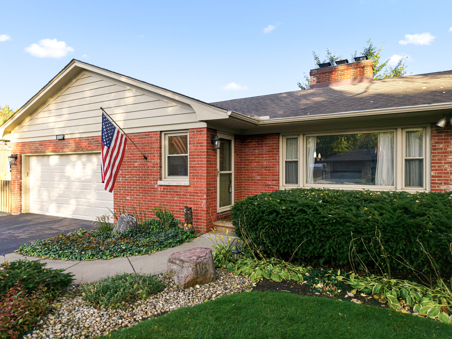 1360 Florence Drive Sycamore, IL 60178 - Photo 2 of 48 a front view of a house with a garden