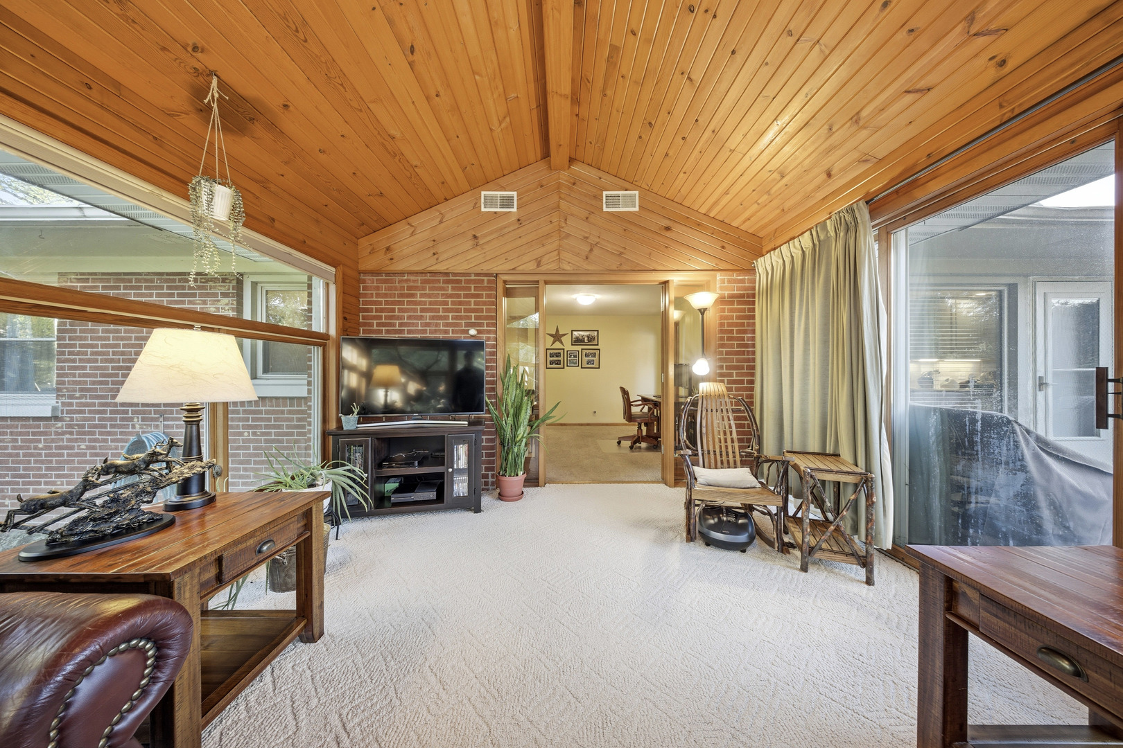 1360 Florence Drive Sycamore, IL 60178 - Photo 28 of 48 a living room with furniture a flat screen tv and a fireplace
