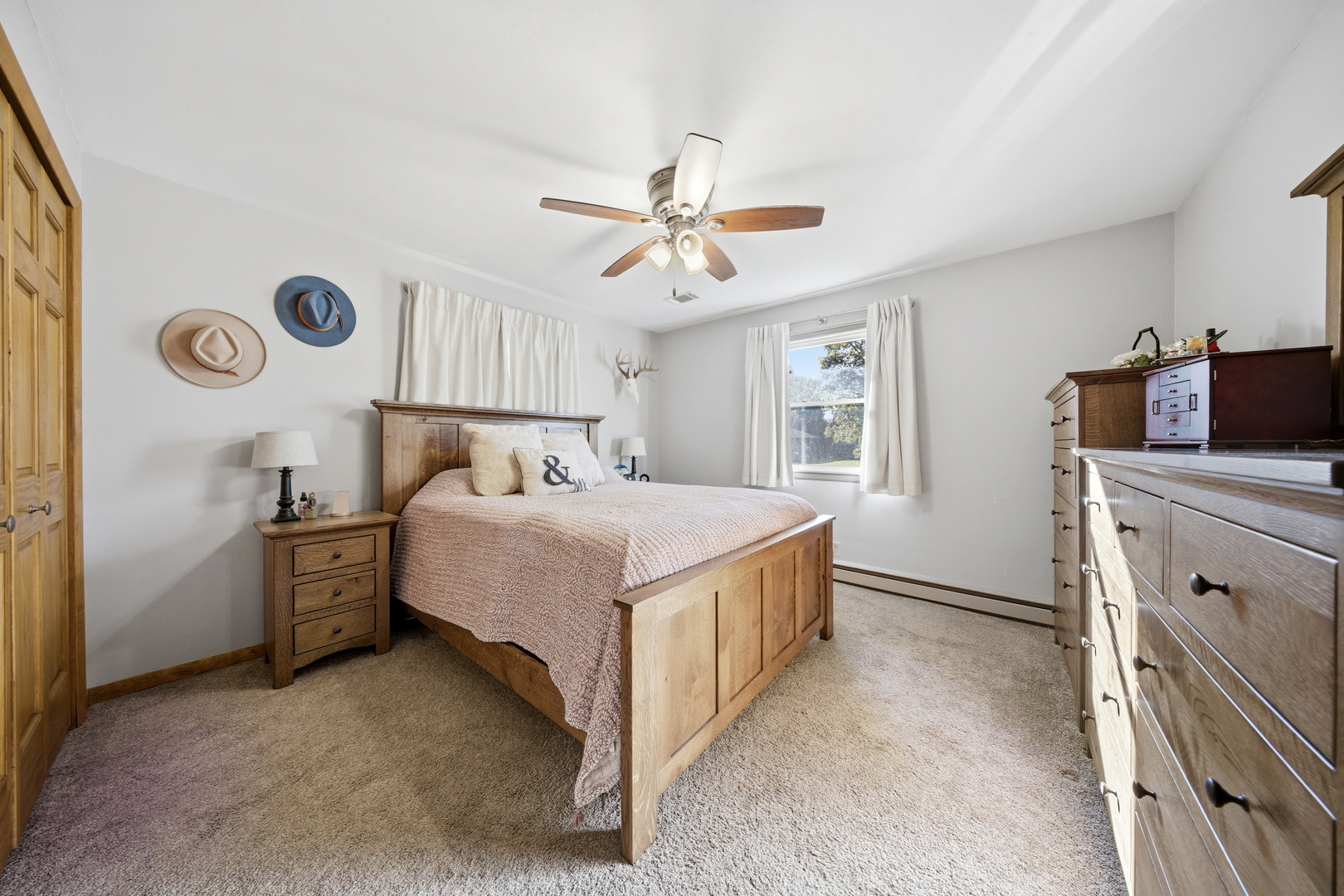 1360 Florence Drive Sycamore, IL 60178 - Photo 30 of 48 a bedroom with a bed and a chandelier