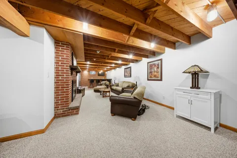 a view of a livingroom with furniture and staircase