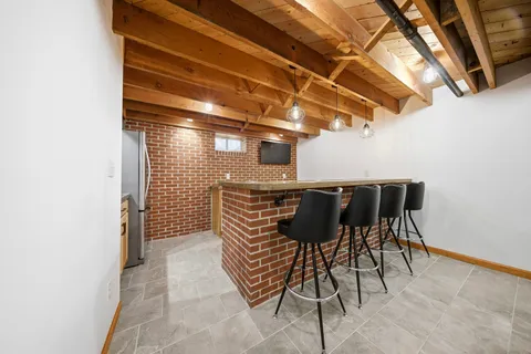 a view of a chairs and table in the patio
