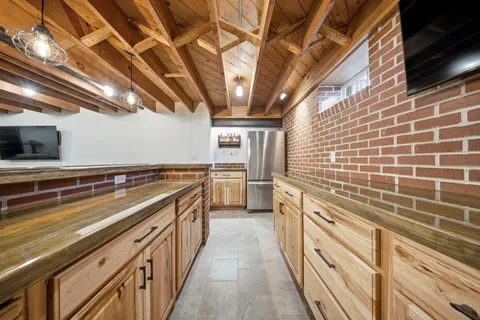 a kitchen with stainless steel appliances a stove sink and cabinets