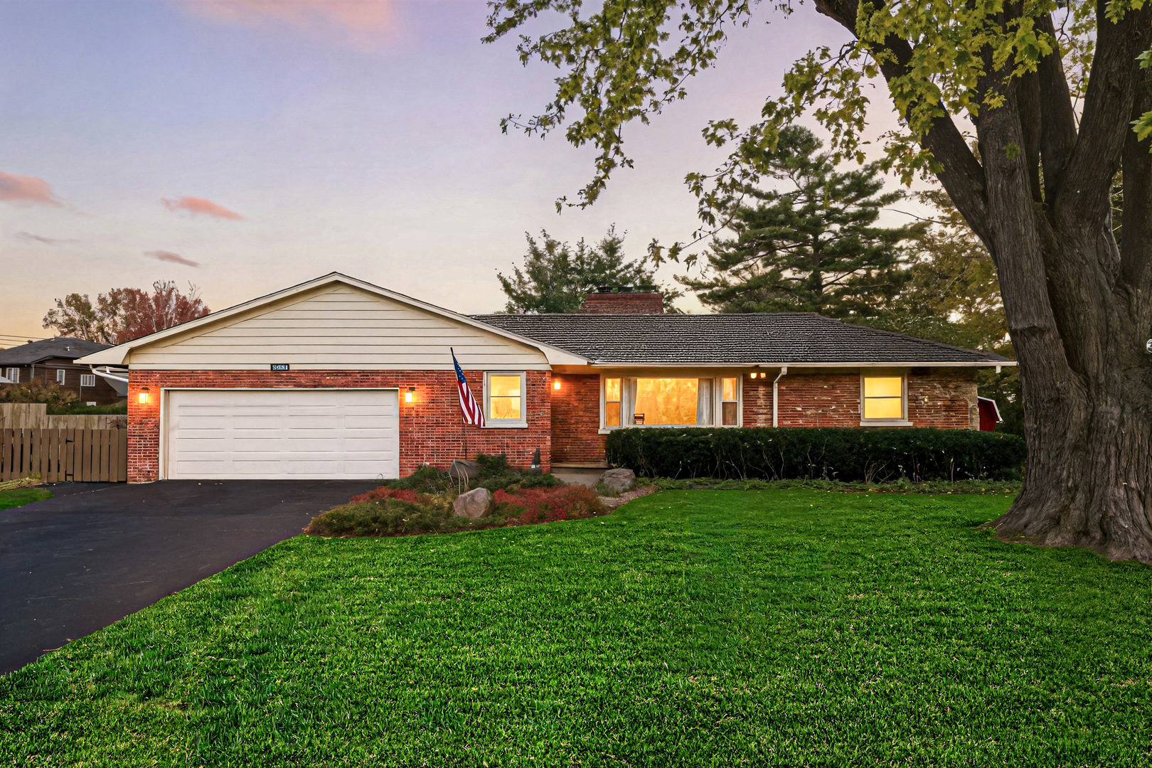 1360 Florence Drive Sycamore, IL 60178 - Photo 45 of 48 a front view of a house with a yard and garage