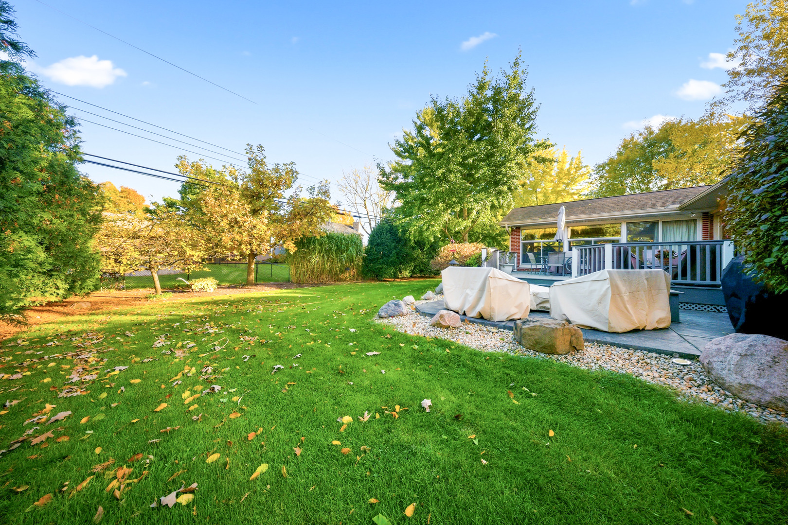 1360 Florence Drive Sycamore, IL 60178 - Photo 6 of 48 a view of a house with backyard sitting area and garden