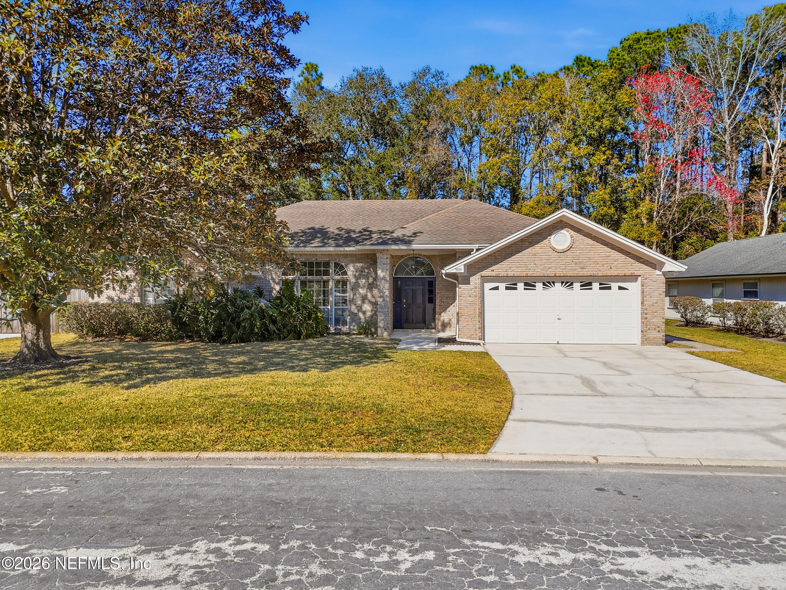 a view of swimming pool with house in background