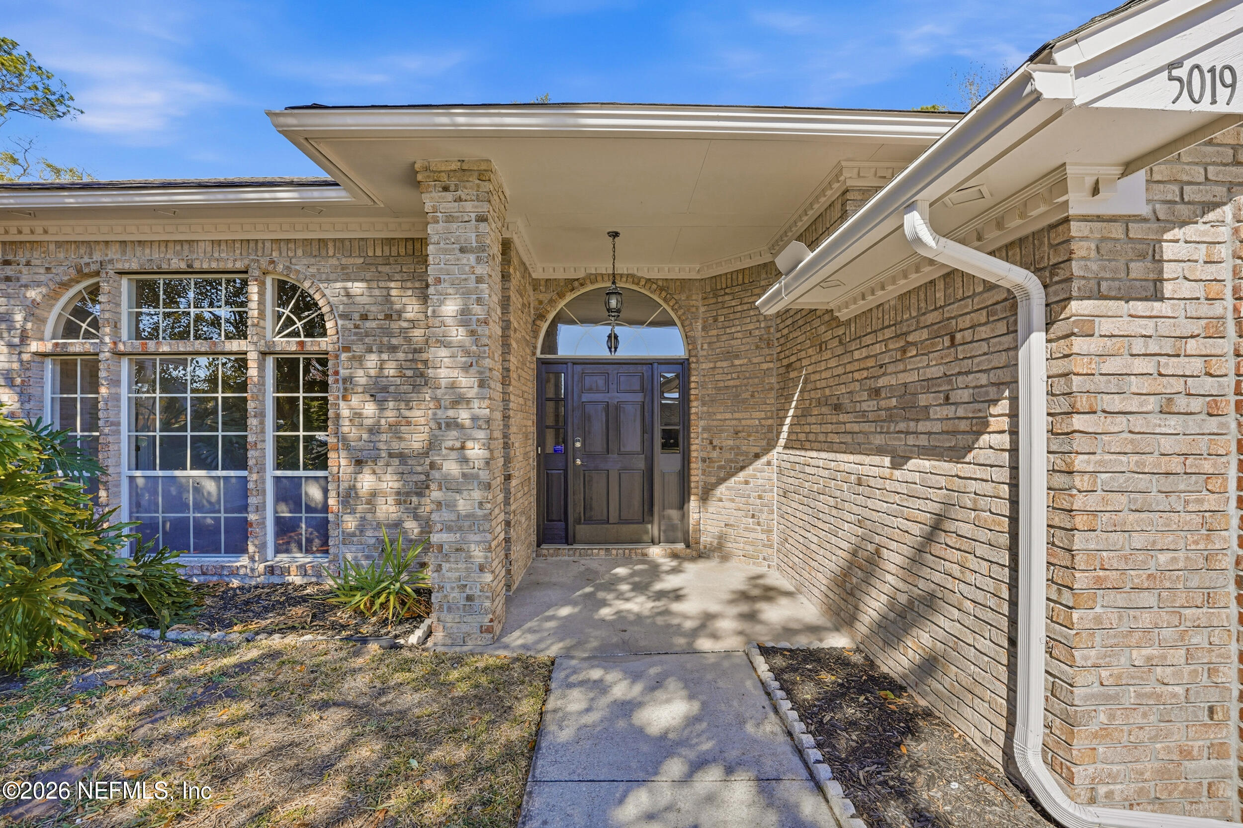 5019 Ripple Rush Drive North Jacksonville, FL 32257 - Photo 2 of 40 a front view of a house with a yard