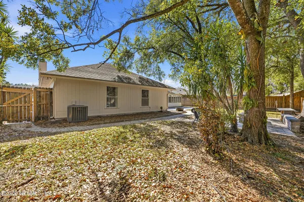 a view of an empty room with closet