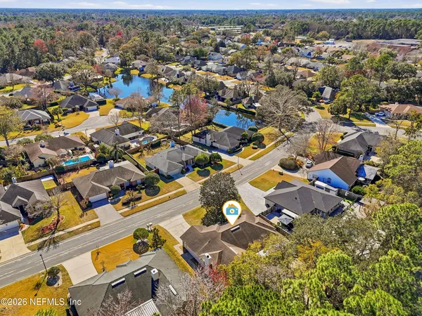 an aerial view of residential houses with outdoor space