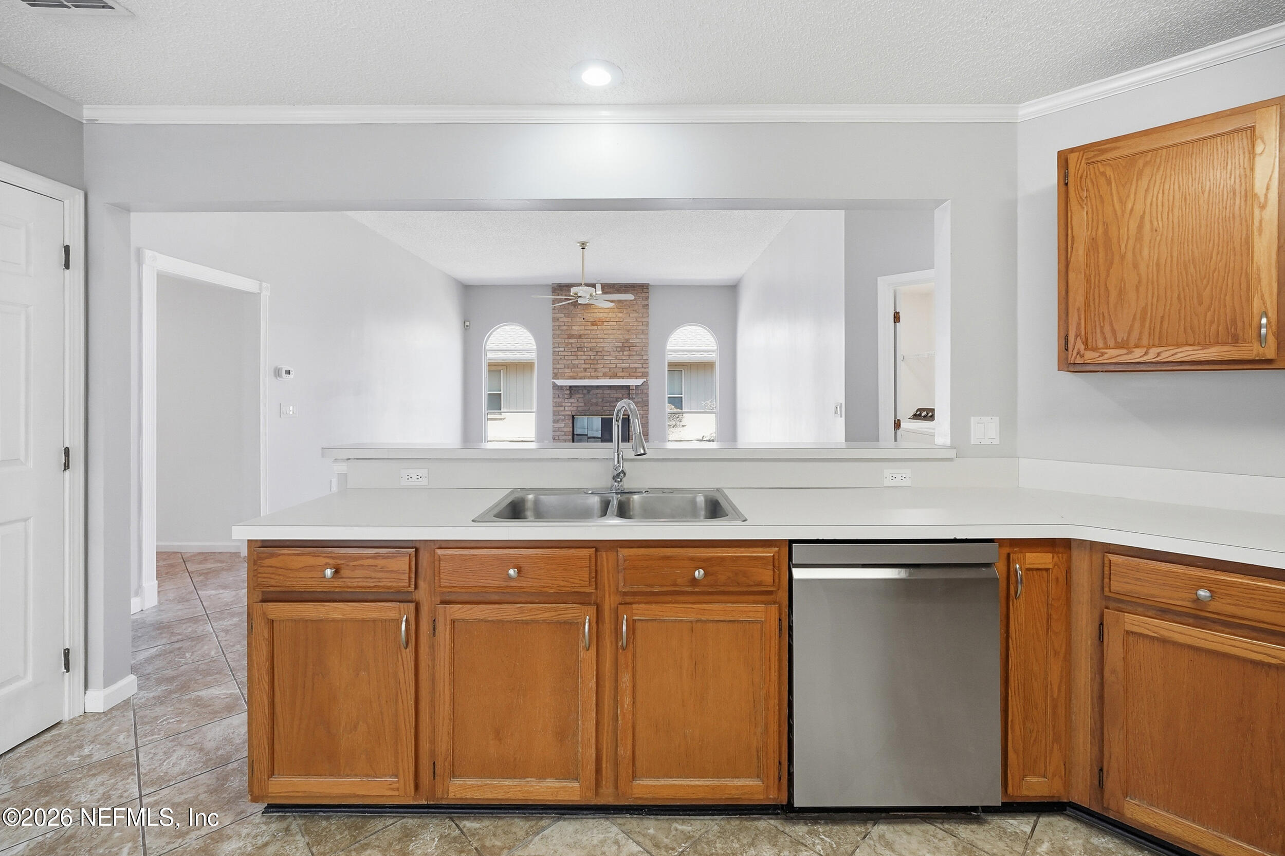 5019 Ripple Rush Drive North Jacksonville, FL 32257 - Photo 5 of 40 a kitchen with sink and cabinets