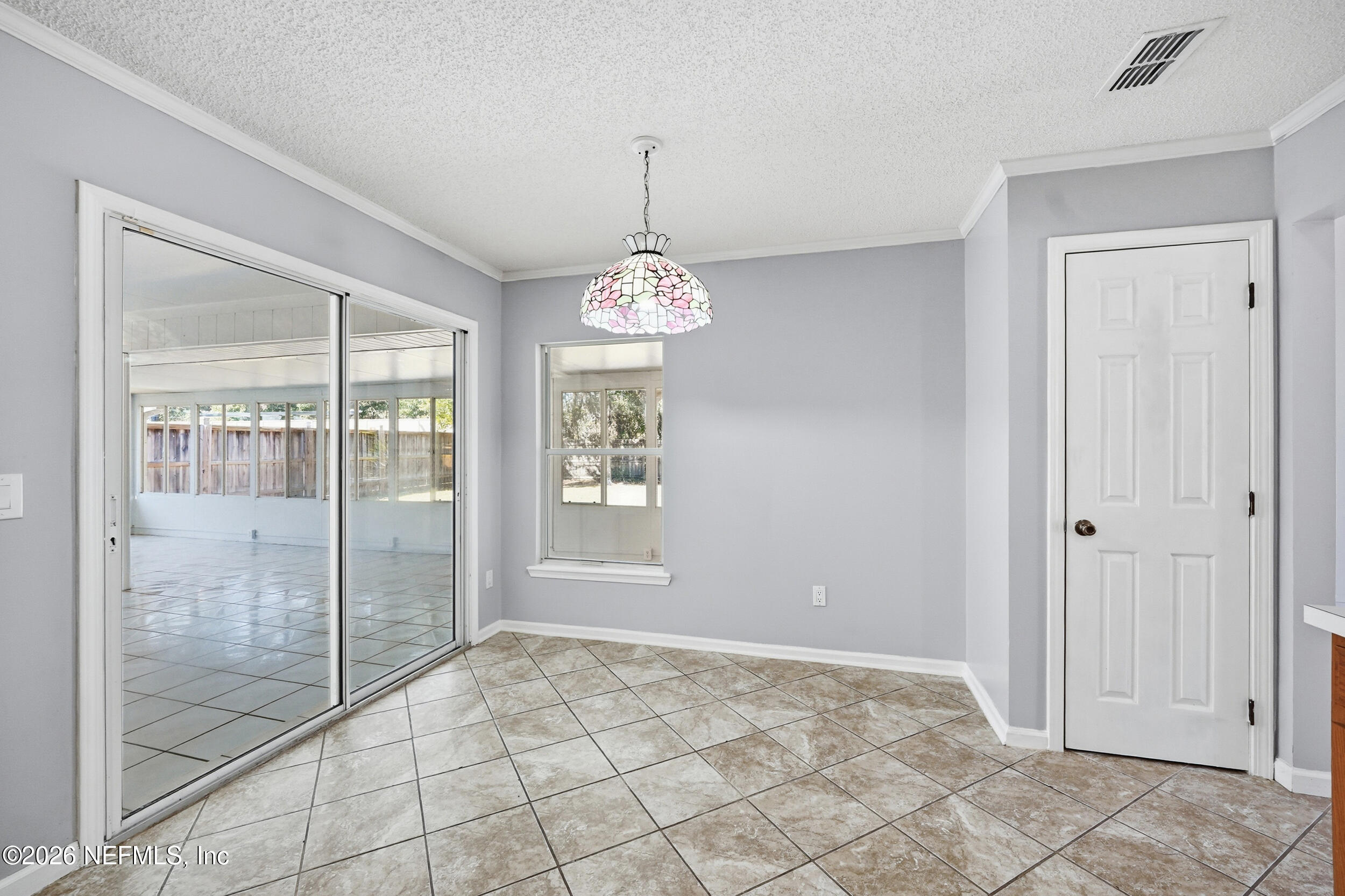 5019 Ripple Rush Drive North Jacksonville, FL 32257 - Photo 7 of 40 a view of an empty room with glass door
