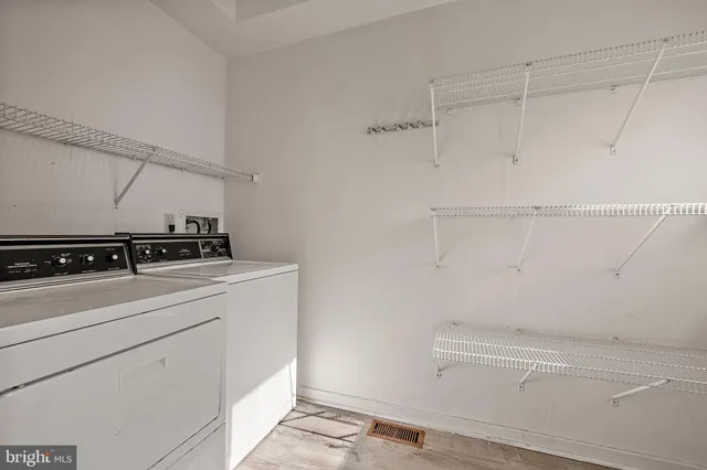 a view of storage and utility room with racks on the wall
