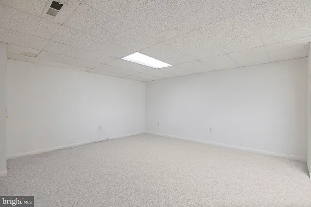 an empty room with a empty space and a window