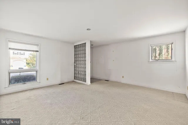 an empty room with windows