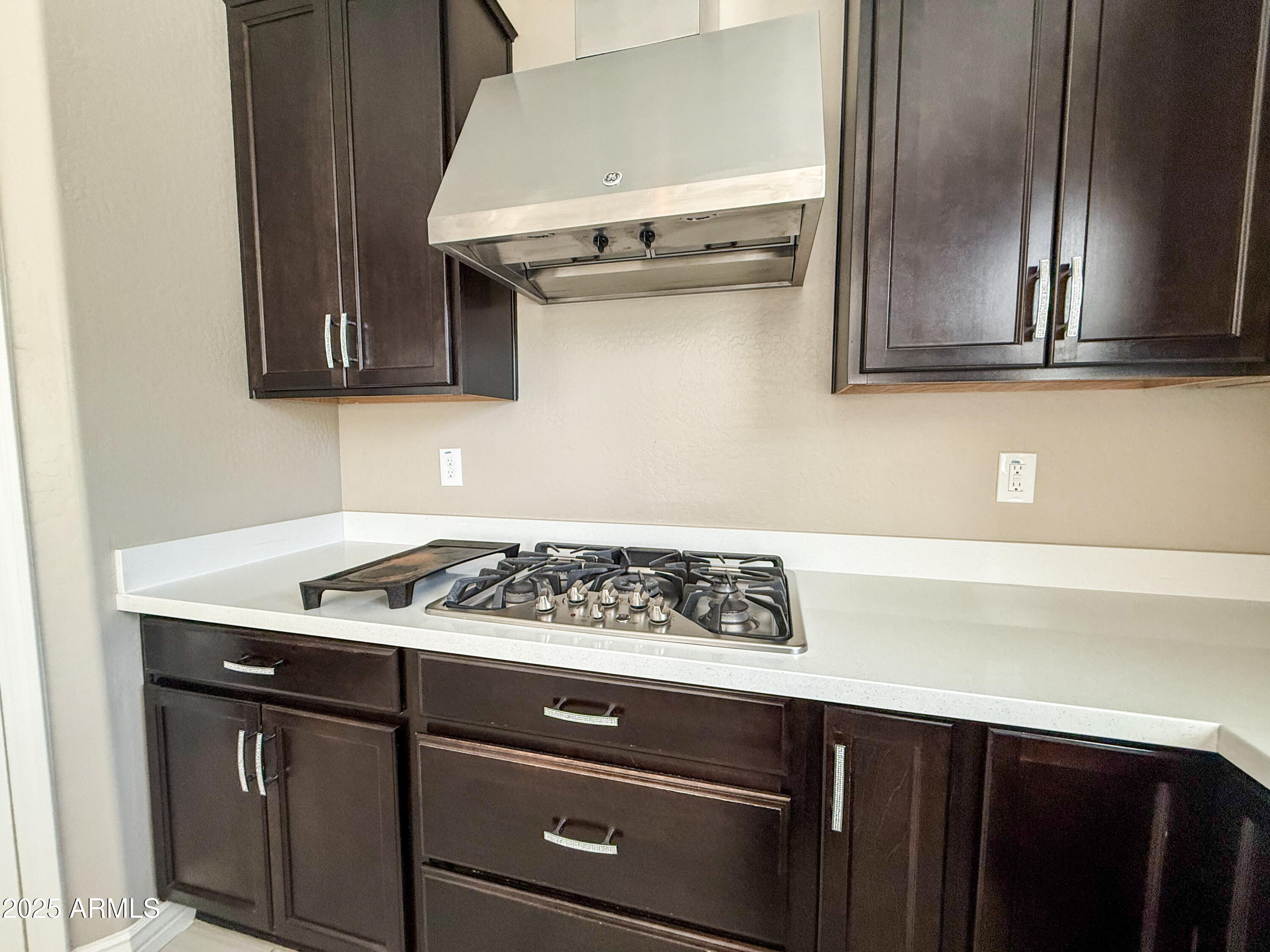 4711 East Daley Lane Phoenix, AZ 85050 - Photo 13 of 43 a kitchen with stainless steel appliances granite countertop a sink stove and cabinets