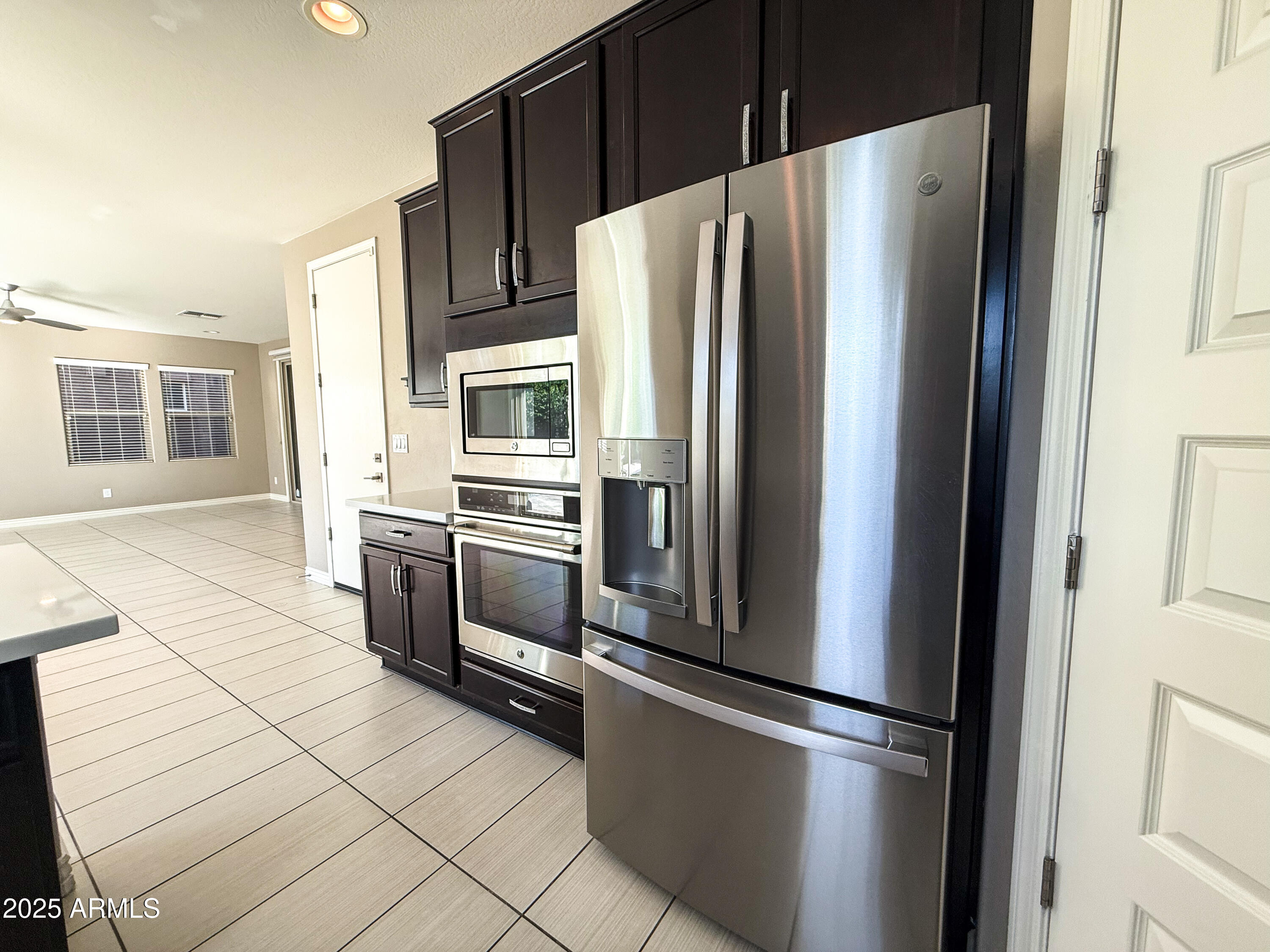 4711 East Daley Lane Phoenix, AZ 85050 - Photo 14 of 43 a kitchen with stainless steel appliances and refrigerator