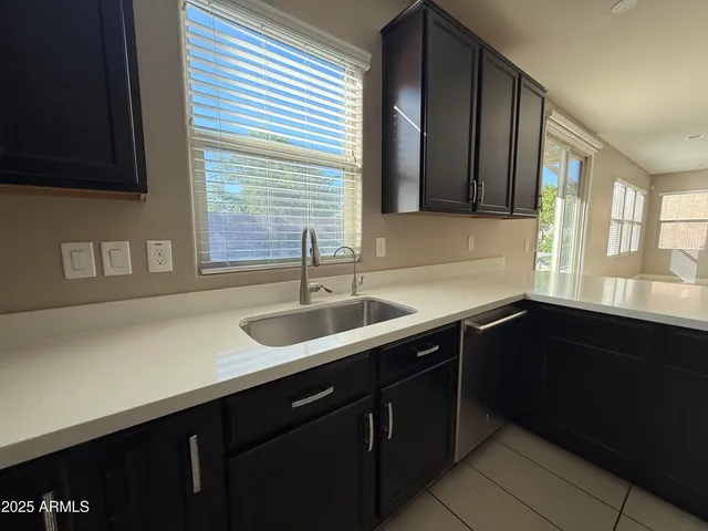 a kitchen with a sink and a window