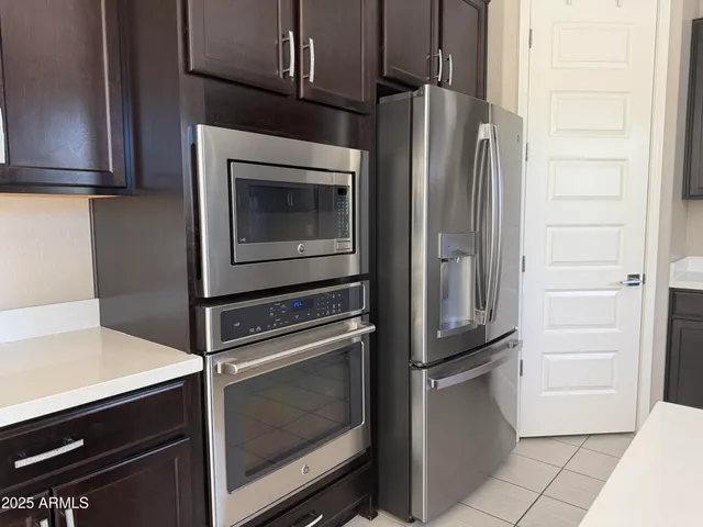 a kitchen with appliances and cabinets