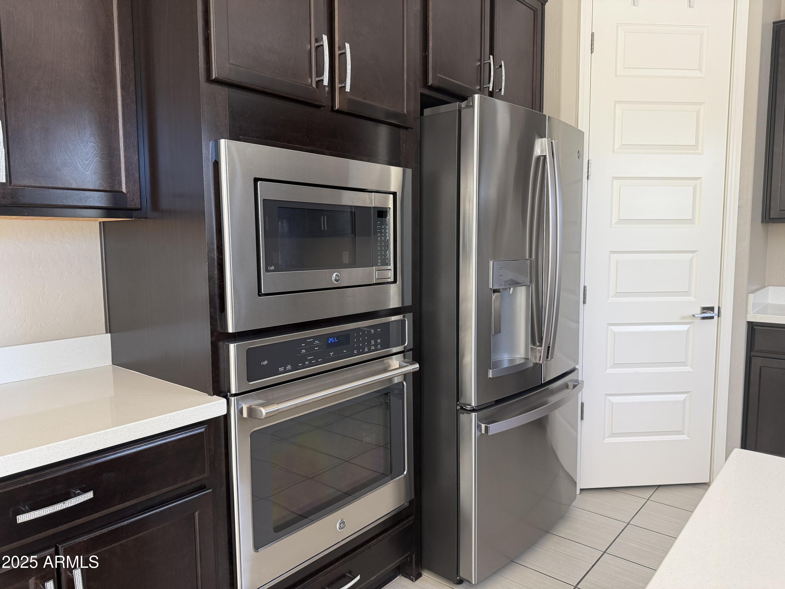 4711 East Daley Lane Phoenix, AZ 85050 - Photo 17 of 43 a kitchen with appliances and cabinets