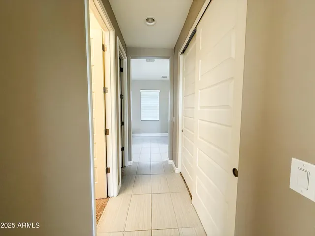 a view of a bathroom from a hallway
