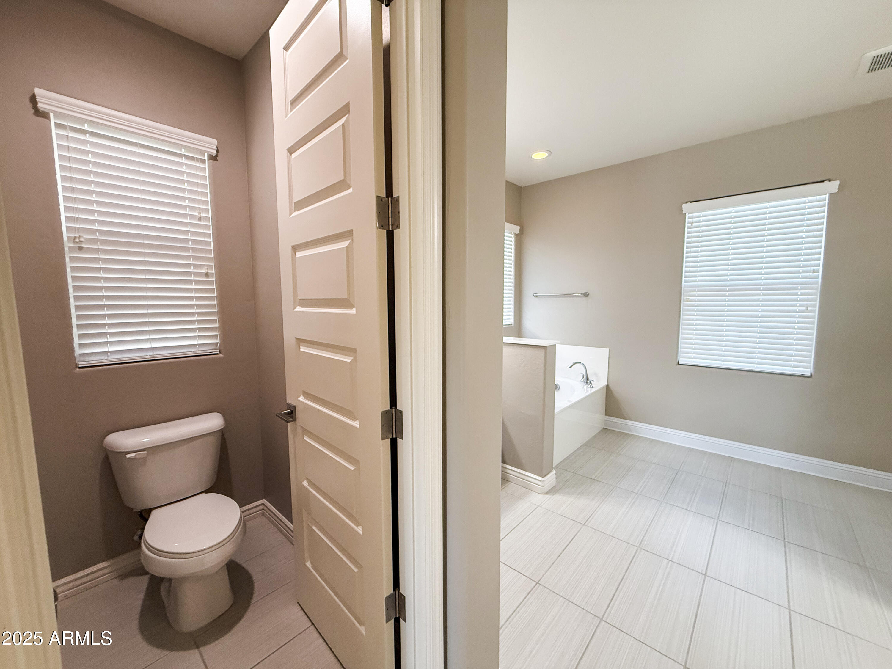 4711 East Daley Lane Phoenix, AZ 85050 - Photo 35 of 43 a bathroom with a toilet sink and a shower