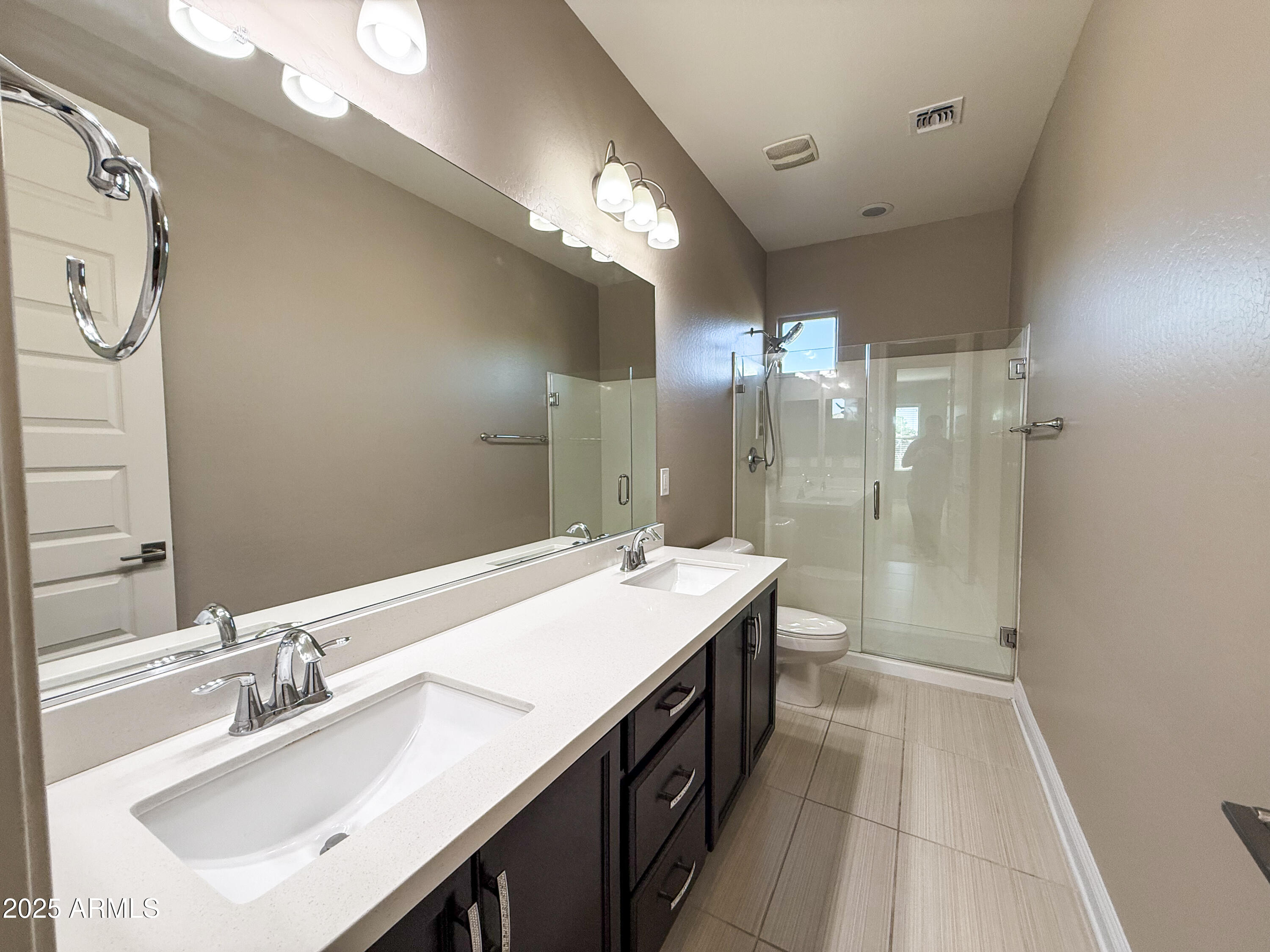 4711 East Daley Lane Phoenix, AZ 85050 - Photo 36 of 43 a bathroom with a sink double vanity granite tub shower and a mirror