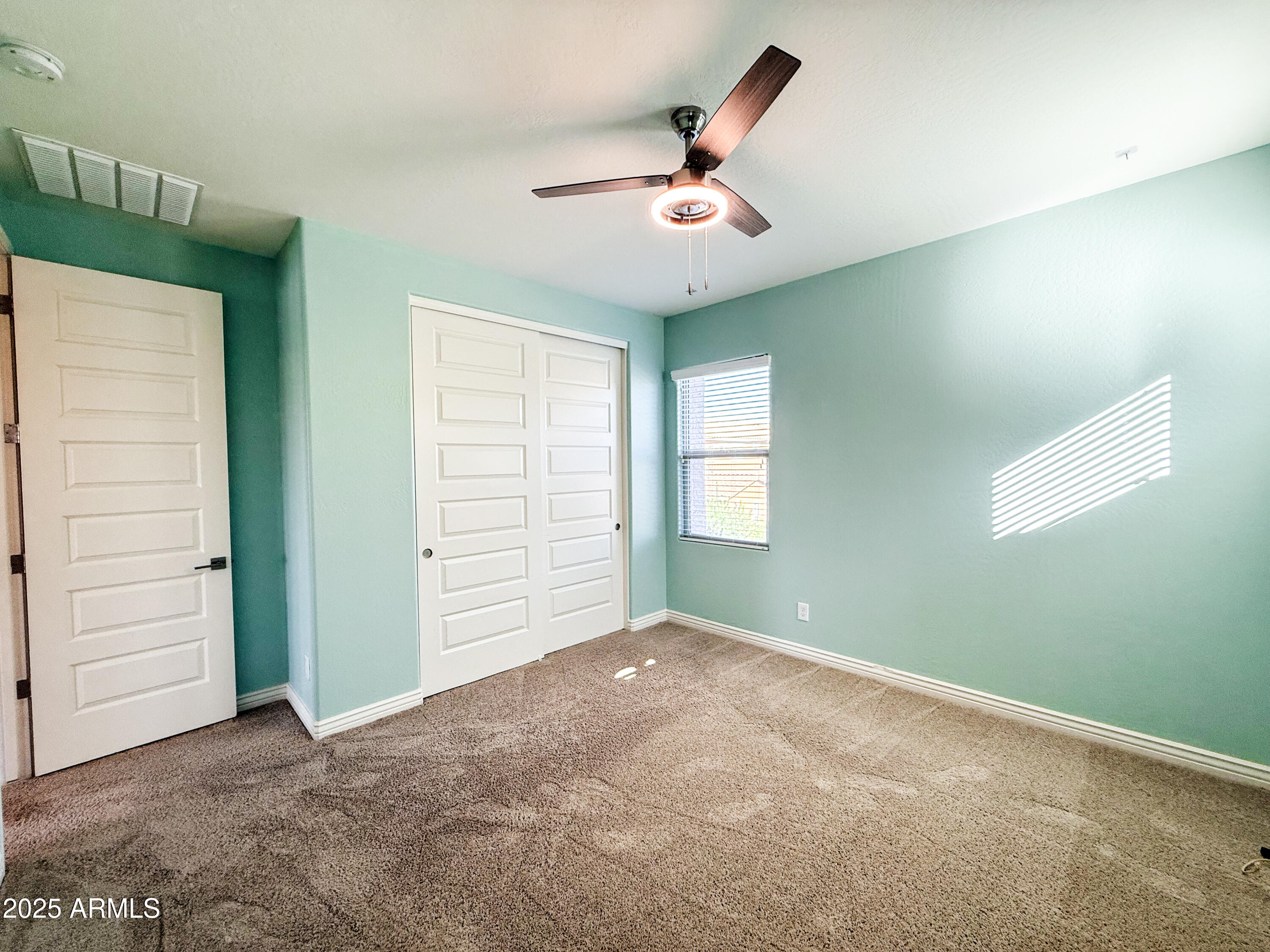 4711 East Daley Lane Phoenix, AZ 85050 - Photo 42 of 43 a view of a livingroom with a ceiling fan and window