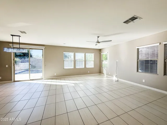 a view of an empty room with glass door
