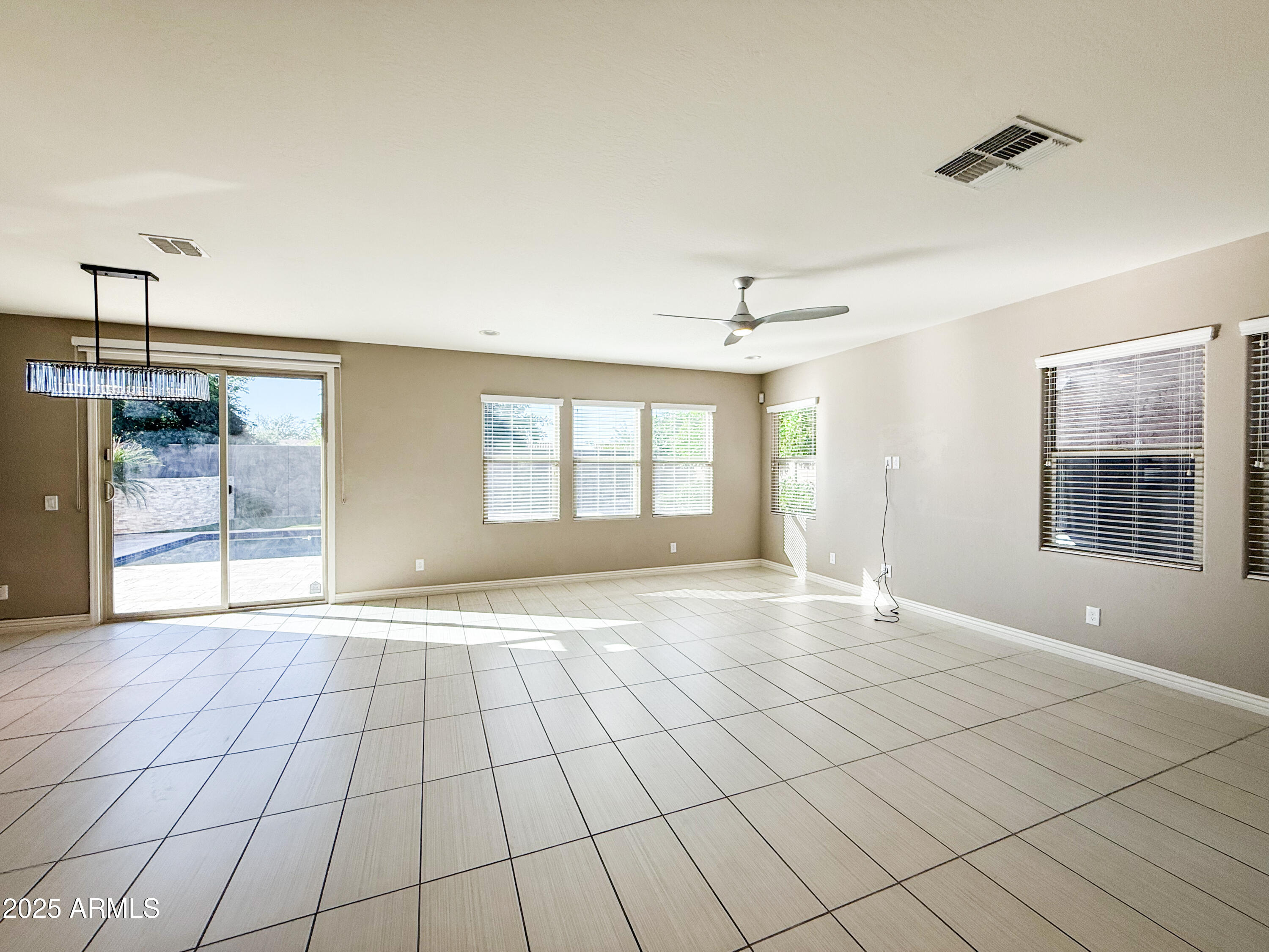 4711 East Daley Lane Phoenix, AZ 85050 - Photo 5 of 43 a view of an empty room with glass door