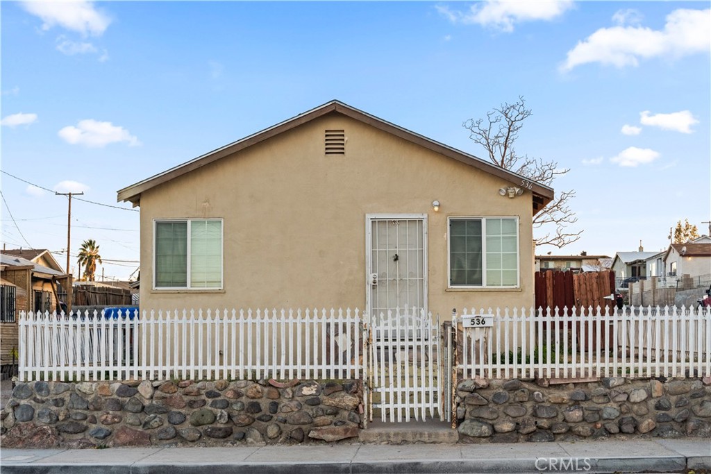 536 East Fredricks Street Barstow, CA 92311 - Photo 1 of 1 a view of a house with a fence