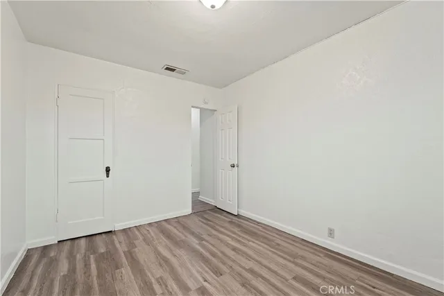 a view of room with wooden floor