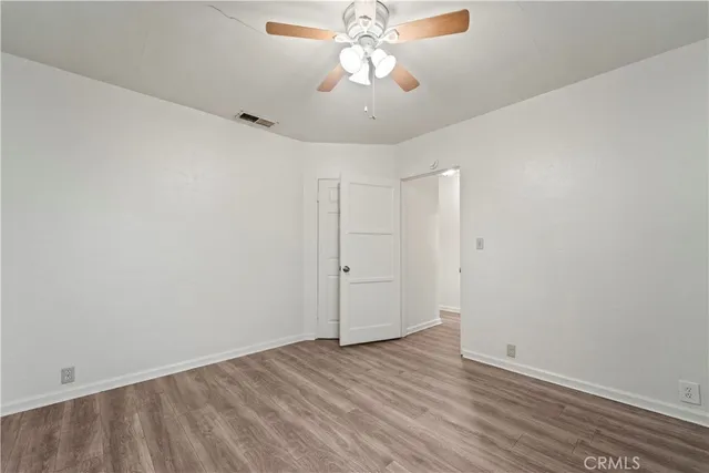 a kitchen with granite countertop a sink and a stove top oven