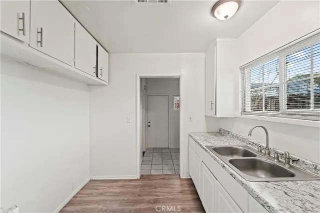 a kitchen with a sink and cabinets