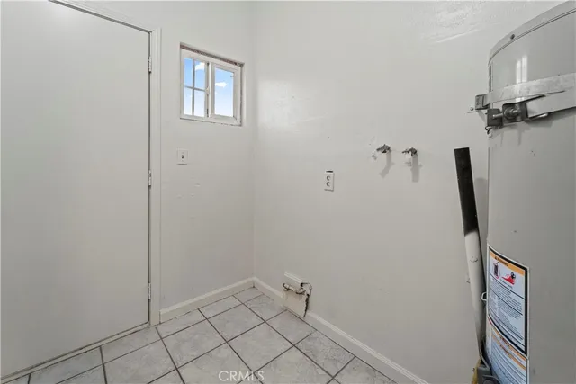 a view of a room with wooden floor and fan