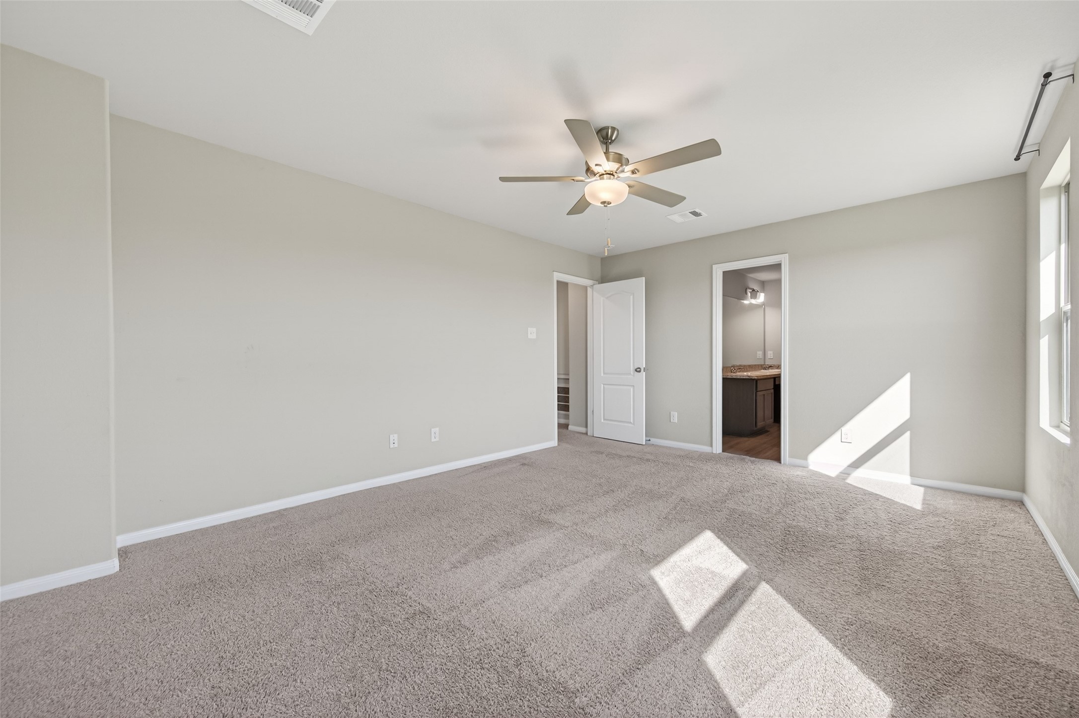 940 21st Street Hempstead, TX 77445 - Photo 17 of 32 a view of an empty room with chandelier fan