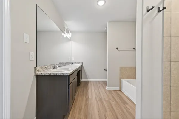 a bathroom with a sink and mirror