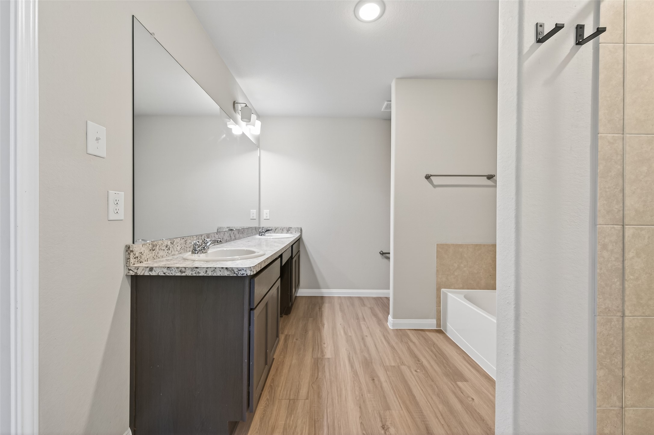 940 21st Street Hempstead, TX 77445 - Photo 18 of 32 a bathroom with a sink and mirror