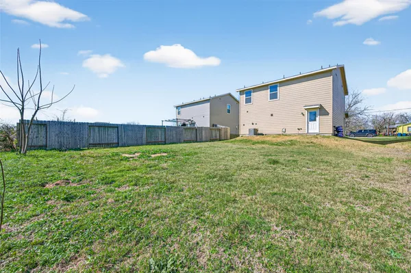 a view of a house with a back yard