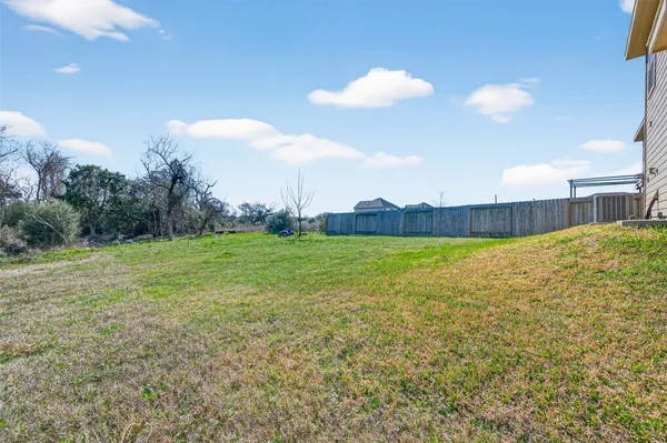 a view of a building and a yard