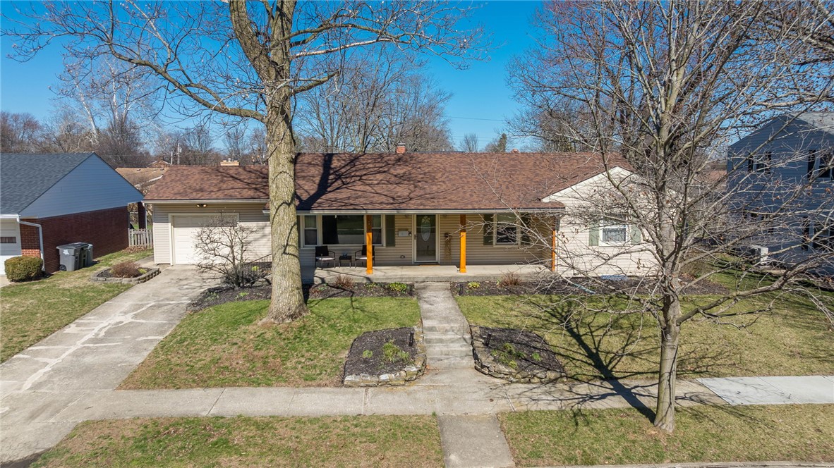 1463 Chelsea Road Troy, OH 45373 - Photo 4 of 39 This charming home offers a welcoming facade with a classic design.