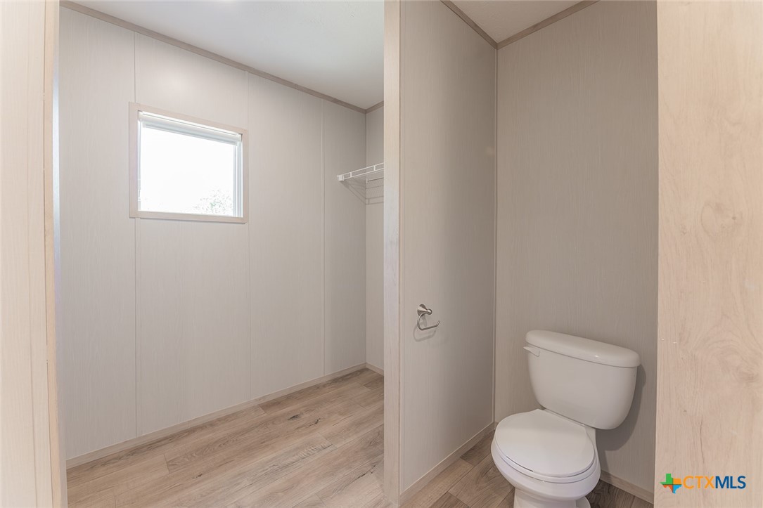 3505 Ivy Gap Road Kempner, TX 76539 - Photo 24 of 43 a white toilet sitting next to a small window