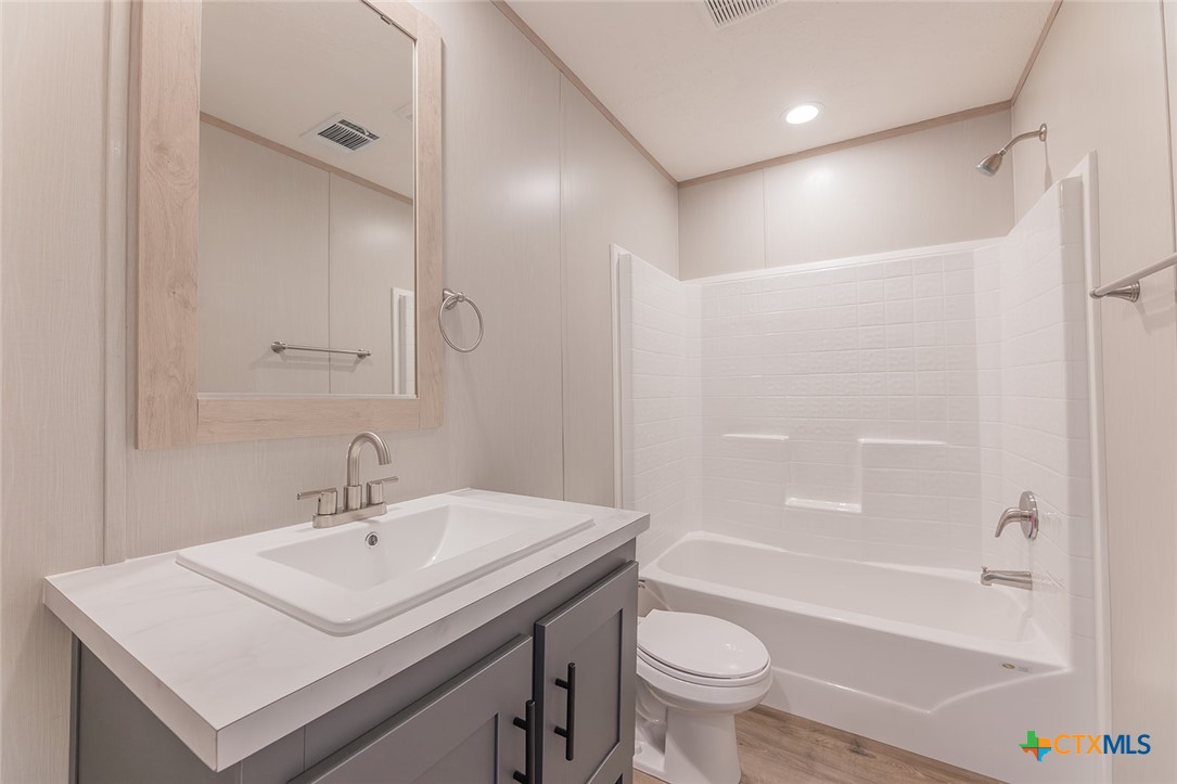 3505 Ivy Gap Road Kempner, TX 76539 - Photo 29 of 43 a bathroom with a sink a toilet and a bathtub