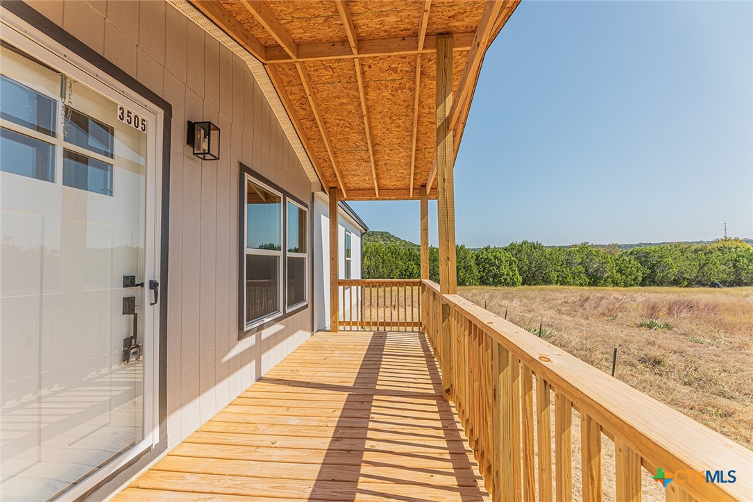 3505 Ivy Gap Road Kempner, TX 76539 - Photo 36 of 43 a view of balcony with wooden floor and fence