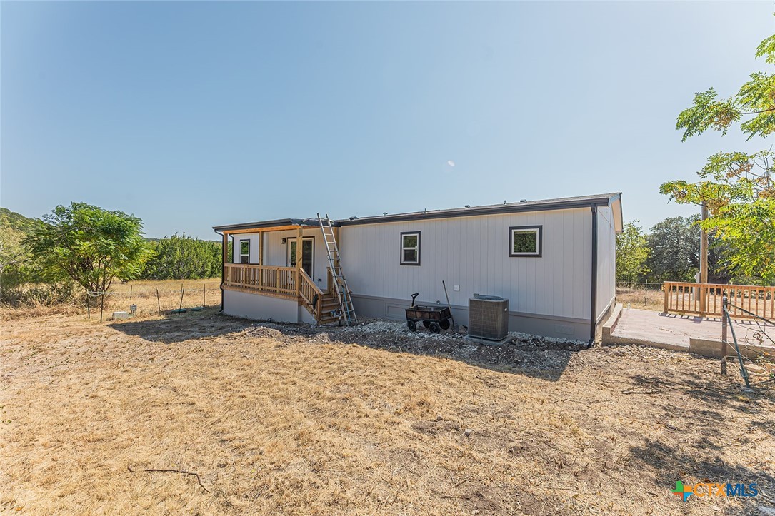 3505 Ivy Gap Road Kempner, TX 76539 - Photo 37 of 43 a backyard of a house with table and chairs