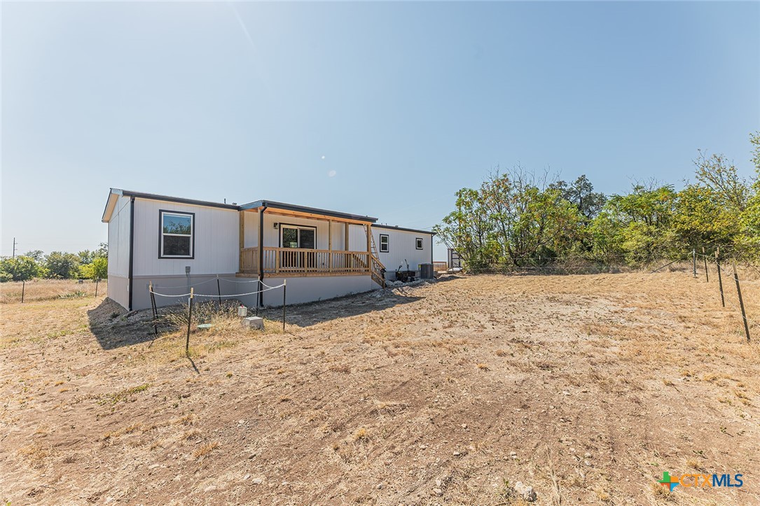 3505 Ivy Gap Road Kempner, TX 76539 - Photo 40 of 43 a backyard of a house with a yard and garage