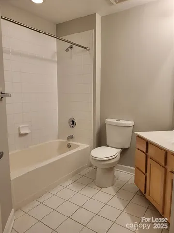 a bathroom with a toilet a sink and bathtub