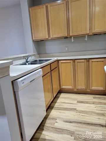a kitchen with a sink and cabinets